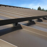 Snow retention on standing seam roofing