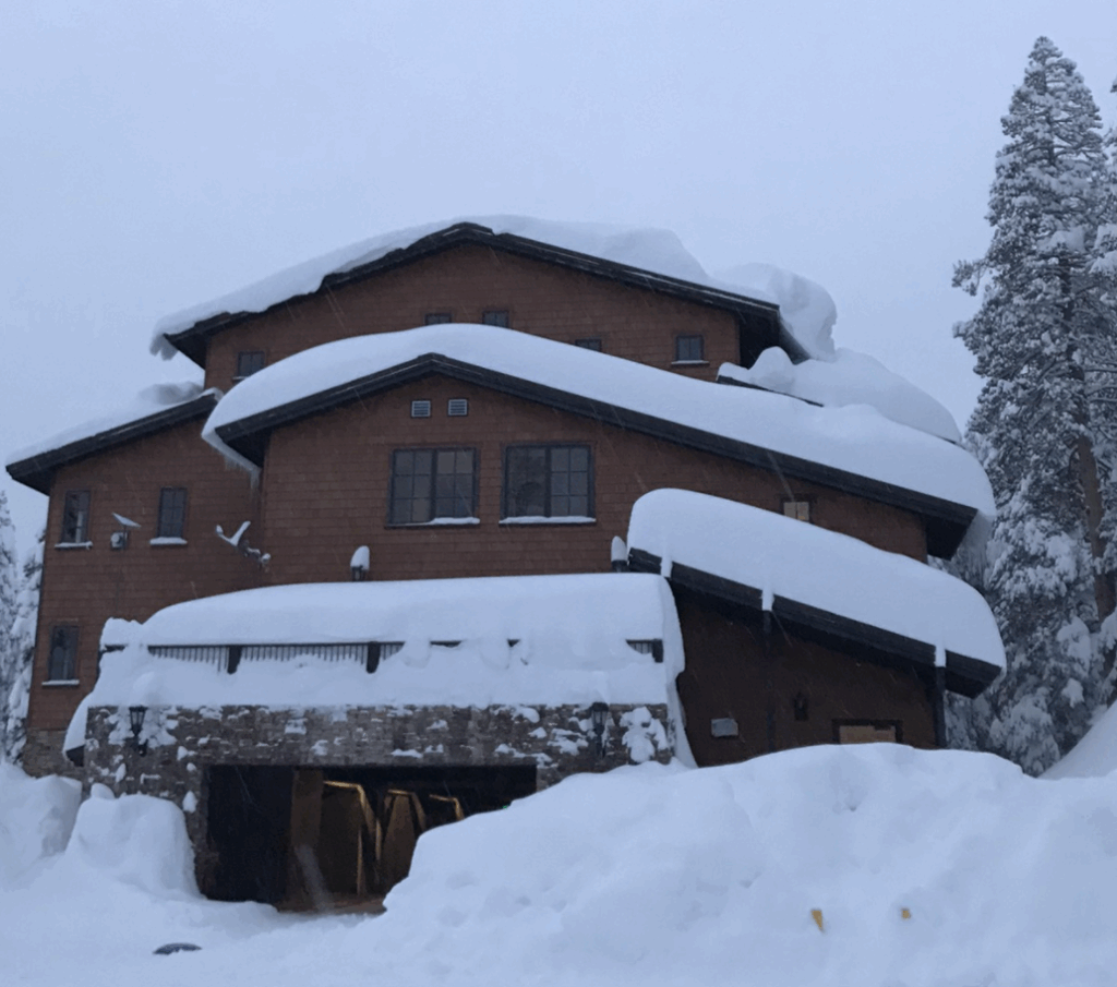 Residential home with metal roofing and snow guards